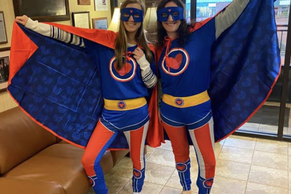 About Us - Jamie and Tamera Dressed Up as Superheroes